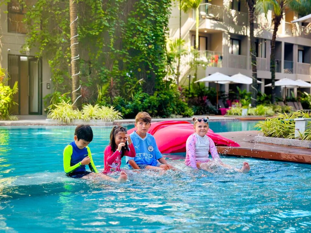 Children enjoying the swimming pool at Diamond Resort Phuket